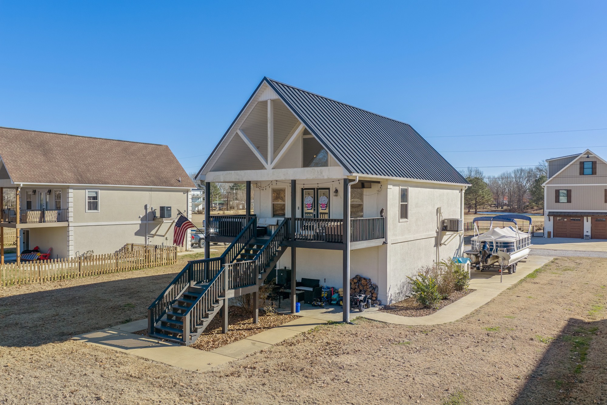 222 Fairway Villa Lane Decaturville, TN 38329 - Photo 2 of 36 a front view of a house with a yard