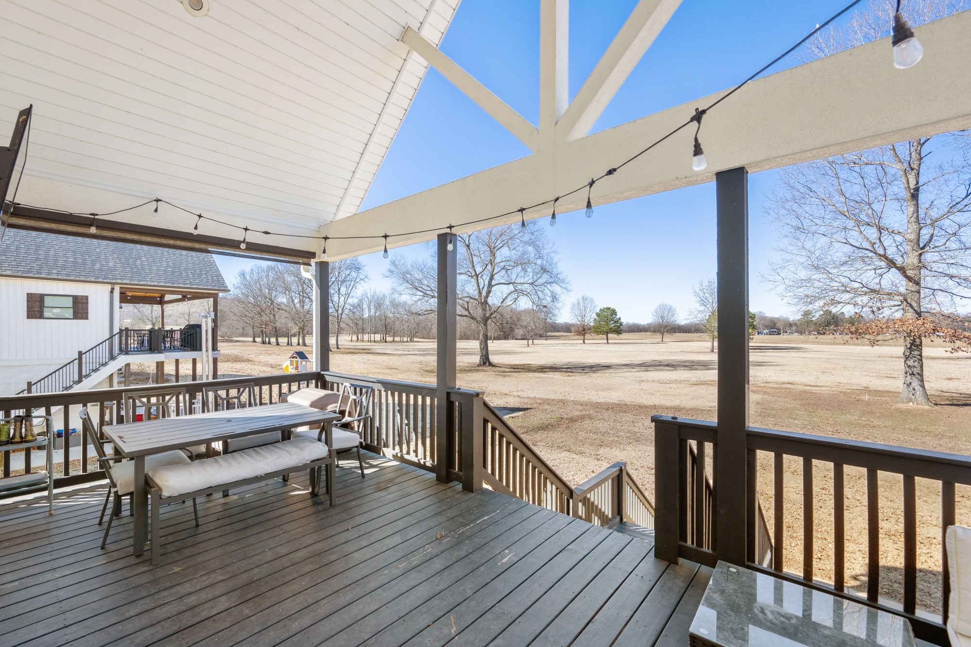 222 Fairway Villa Lane Decaturville, TN 38329 - Photo 25 of 36 a view of balcony with couch and wooden floor