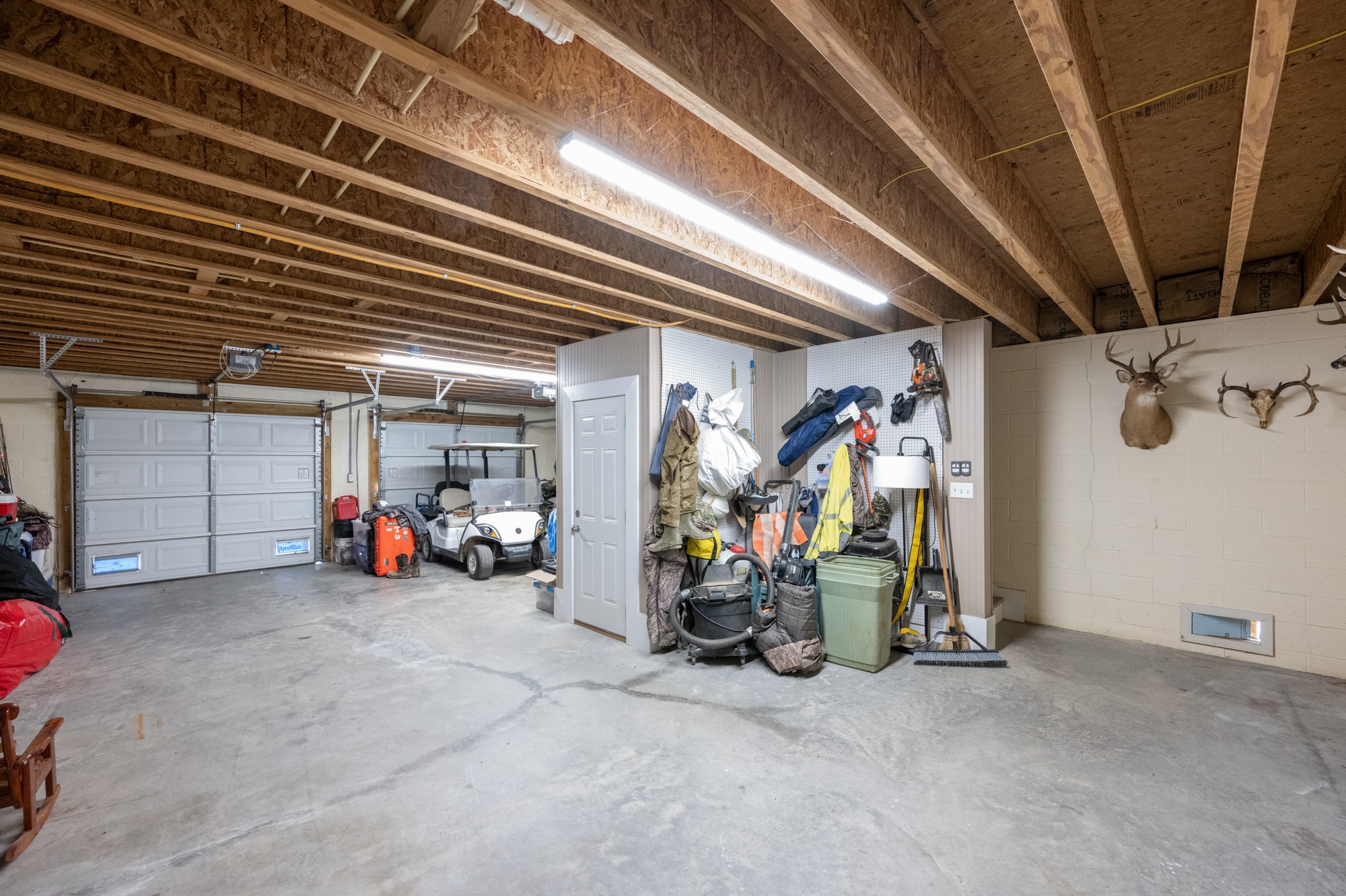 222 Fairway Villa Lane Decaturville, TN 38329 - Photo 28 of 36 a view of a garage with rack and bicycle