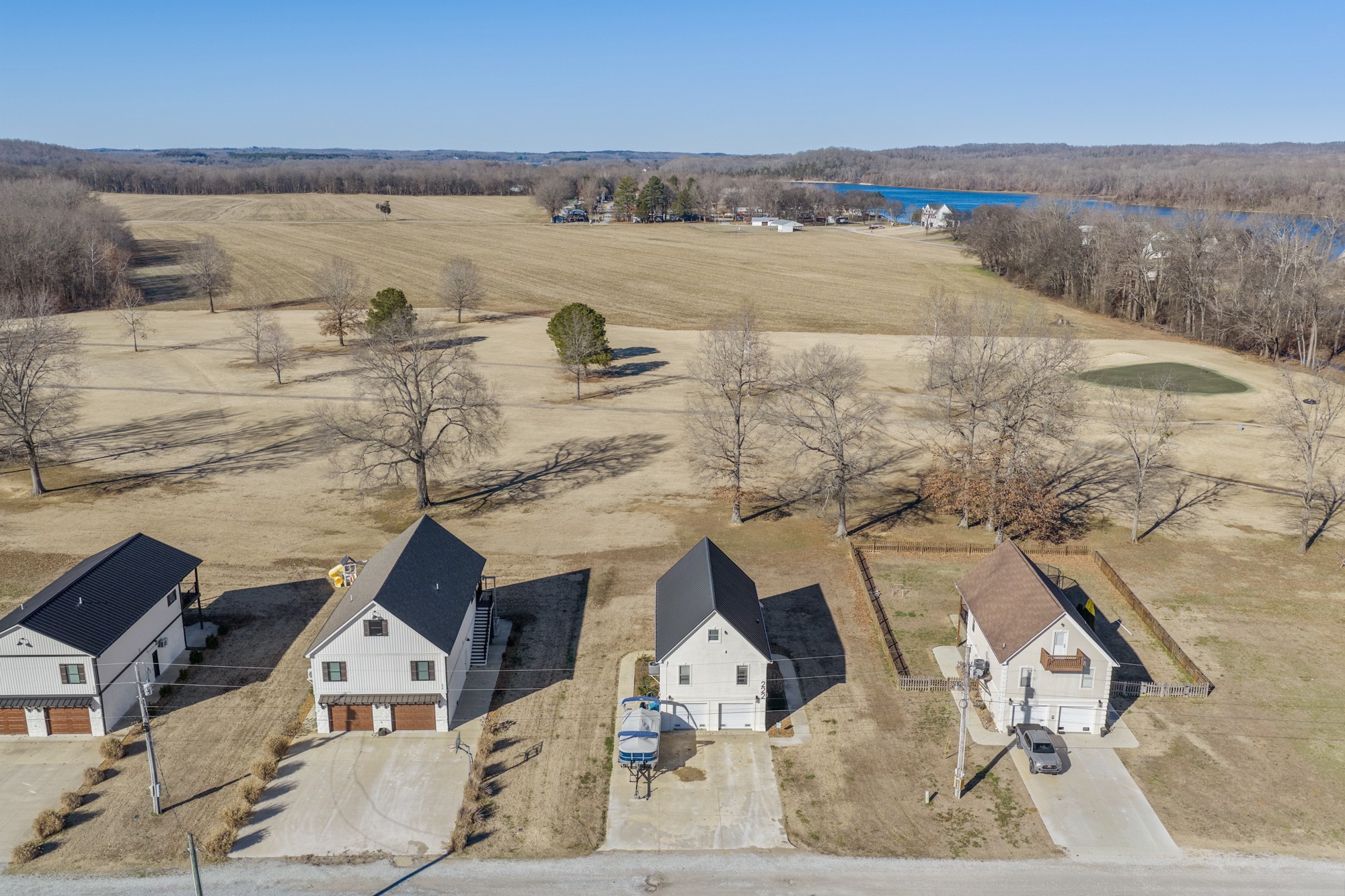 222 Fairway Villa Lane Decaturville, TN 38329 - Photo 31 of 36 an aerial view of a house with a lake view