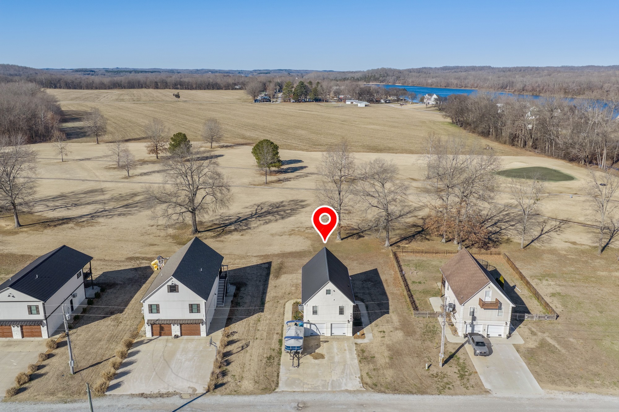 222 Fairway Villa Lane Decaturville, TN 38329 - Photo 6 of 36 an aerial view of houses with outdoor space
