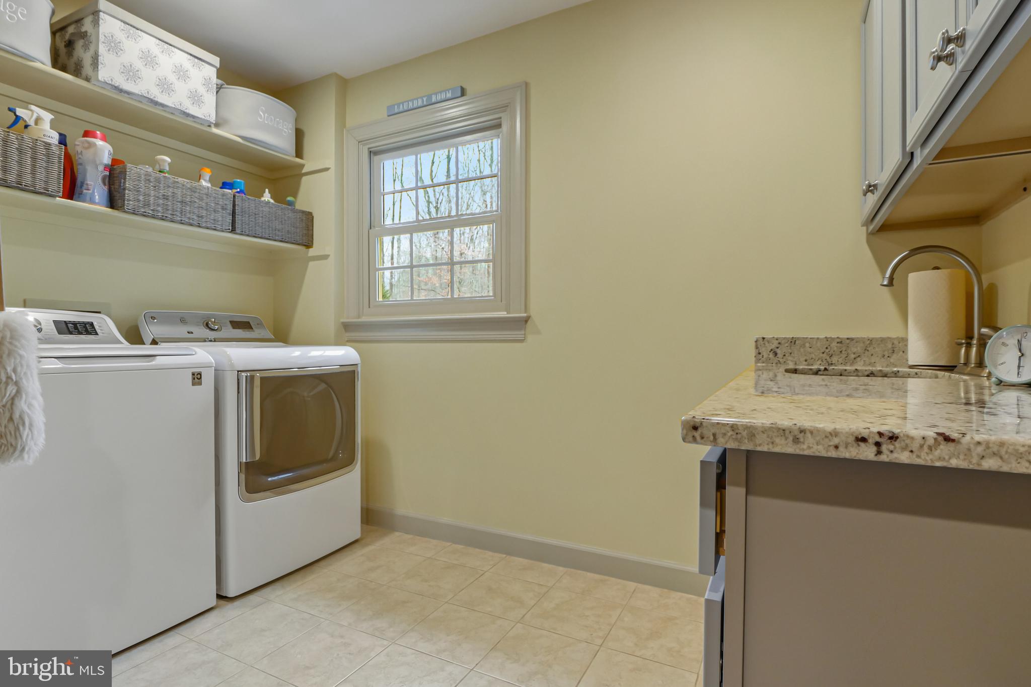 7407 Willowbrook Road Fairfax Station, VA 22039 - Photo 20 of 55 Counter space, sink, and full sized W/D