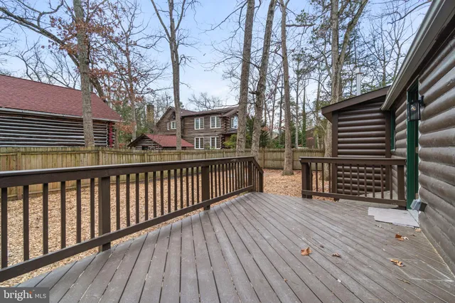 a view of deck with wooden floor and fence