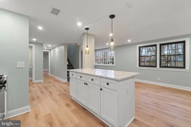 a spacious bathroom with double vanity and a mirror