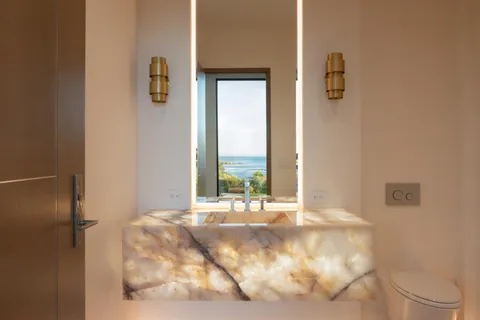 a view of a bathroom with a tub and mirror