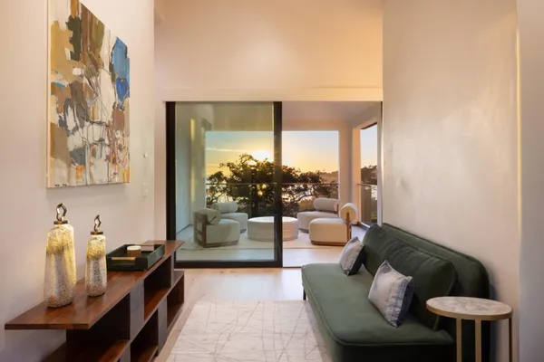 a living room with furniture and a large window
