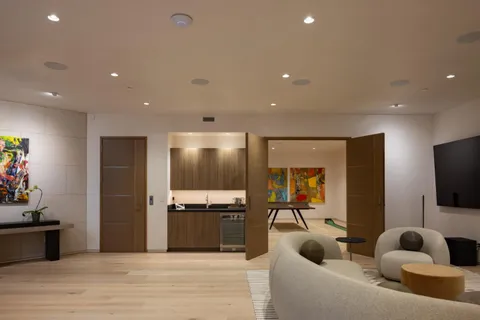 a bedroom with a large bed and a couch