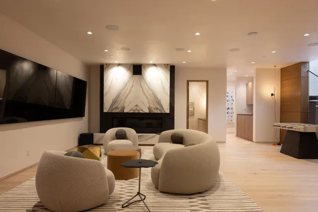 a bedroom with two beds and a large mirror