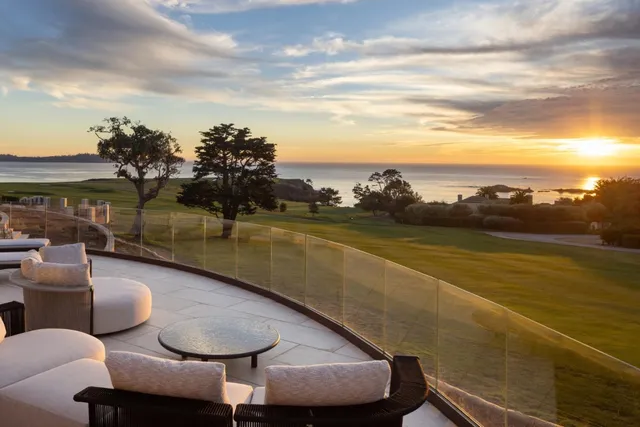 a view of a swimming pool with an ocean view