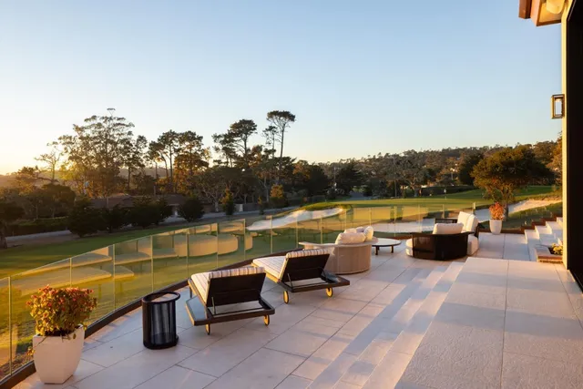 a view of a house with a tub and chairs