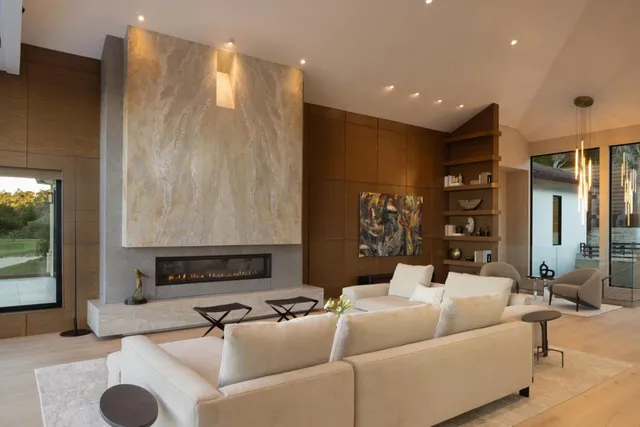 a living room with furniture and a fireplace