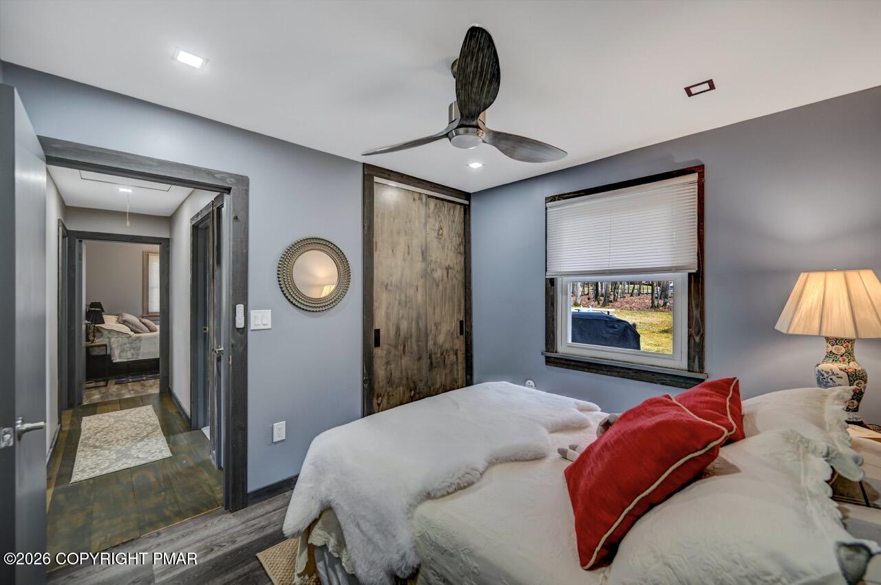 144 Highridge Road Albrightsville, PA 18210 - Photo 63 of 96 a bedroom with a bed and a mirror