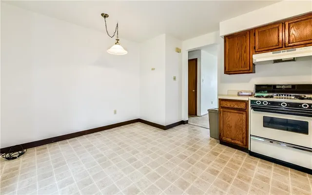 a view of a kitchen with electric appliances