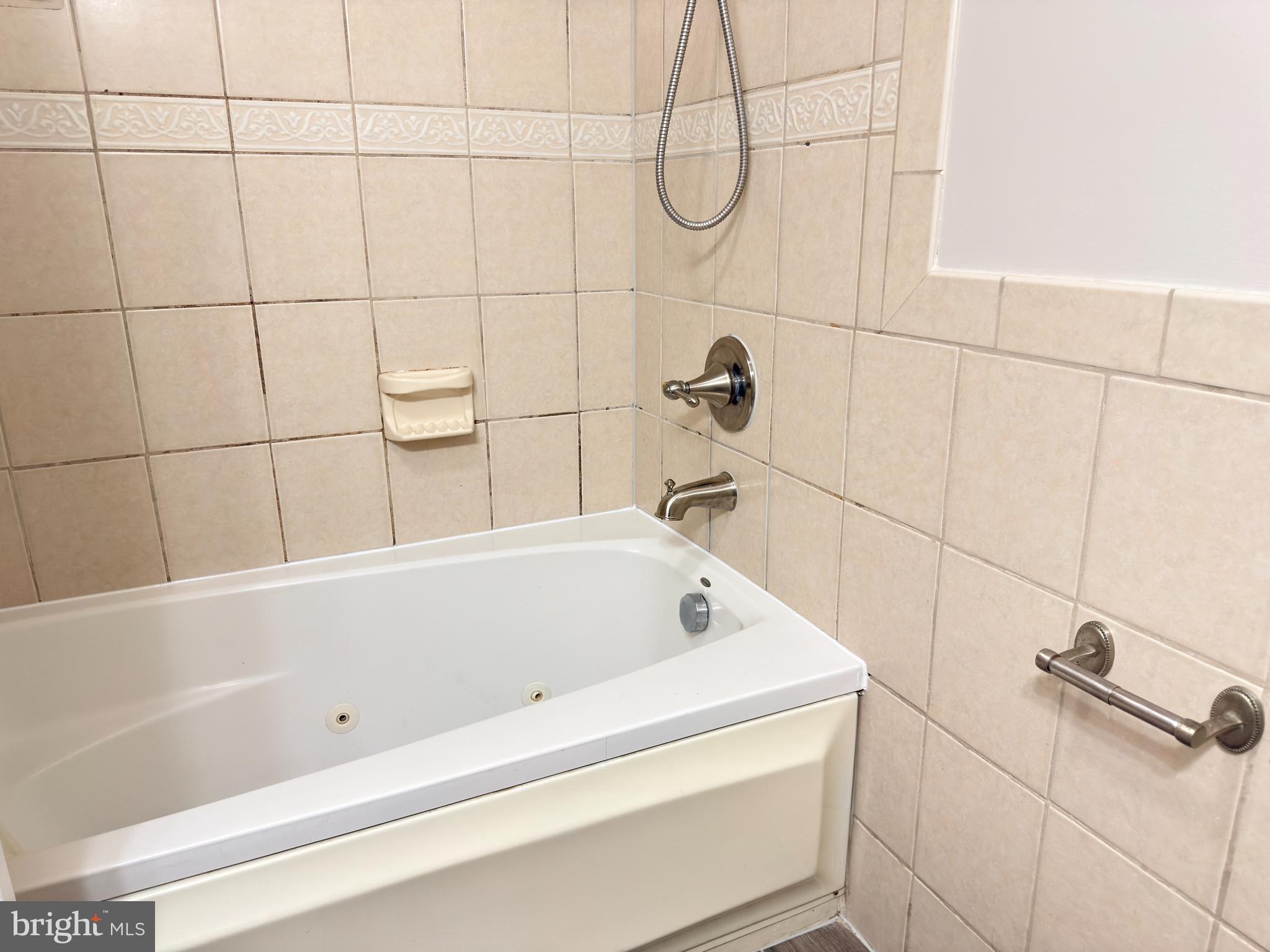 1246 Queen Street Northeast, Unit 2 Washington, DC 20002 - Photo 14 of 23 Charming bathroom with classic tile accents.