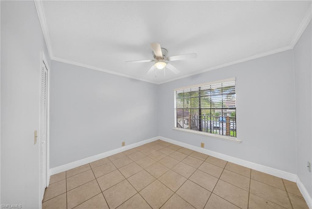5300 Treetops Drive, Unit I206 Naples, FL 34113 - Photo 14 of 17 a view of an empty room with a window