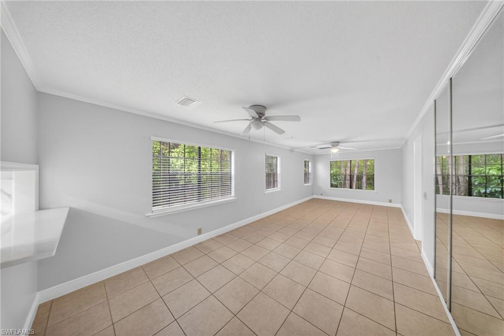 5300 Treetops Drive, Unit I206 Naples, FL 34113 - Photo 6 of 17 a view of an empty room with a window