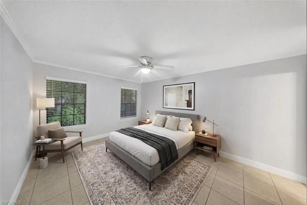 5300 Treetops Drive, Unit I206 Naples, FL 34113 - Photo 8 of 17 a bedroom with a bed and a couch