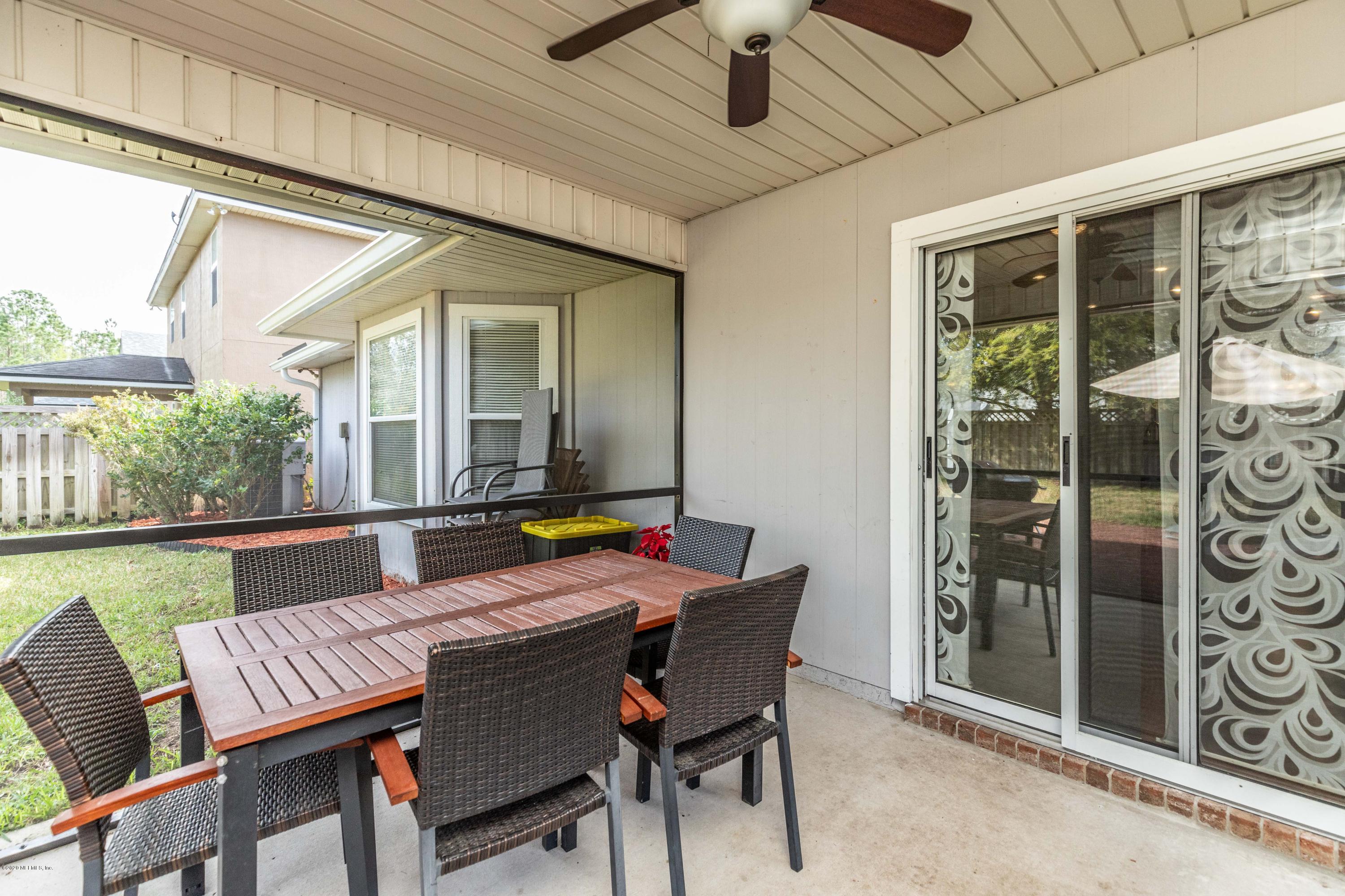 816 Crystal Spring Way St. Augustine, FL 32092 - Photo 27 of 44 a view of a dining room with furniture window and outside view