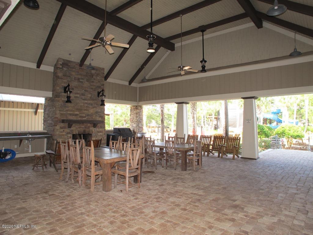 816 Crystal Spring Way St. Augustine, FL 32092 - Photo 35 of 44 a view of a dining room with furniture window and outside view