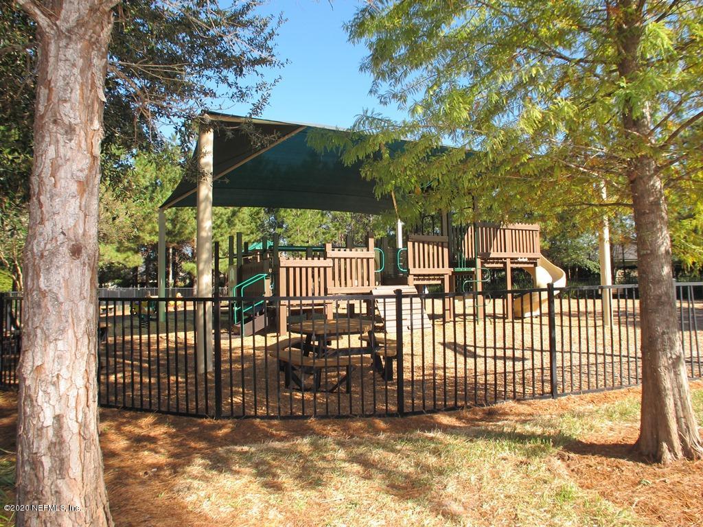 816 Crystal Spring Way St. Augustine, FL 32092 - Photo 44 of 44 a view of a house with a small yard and wooden fence