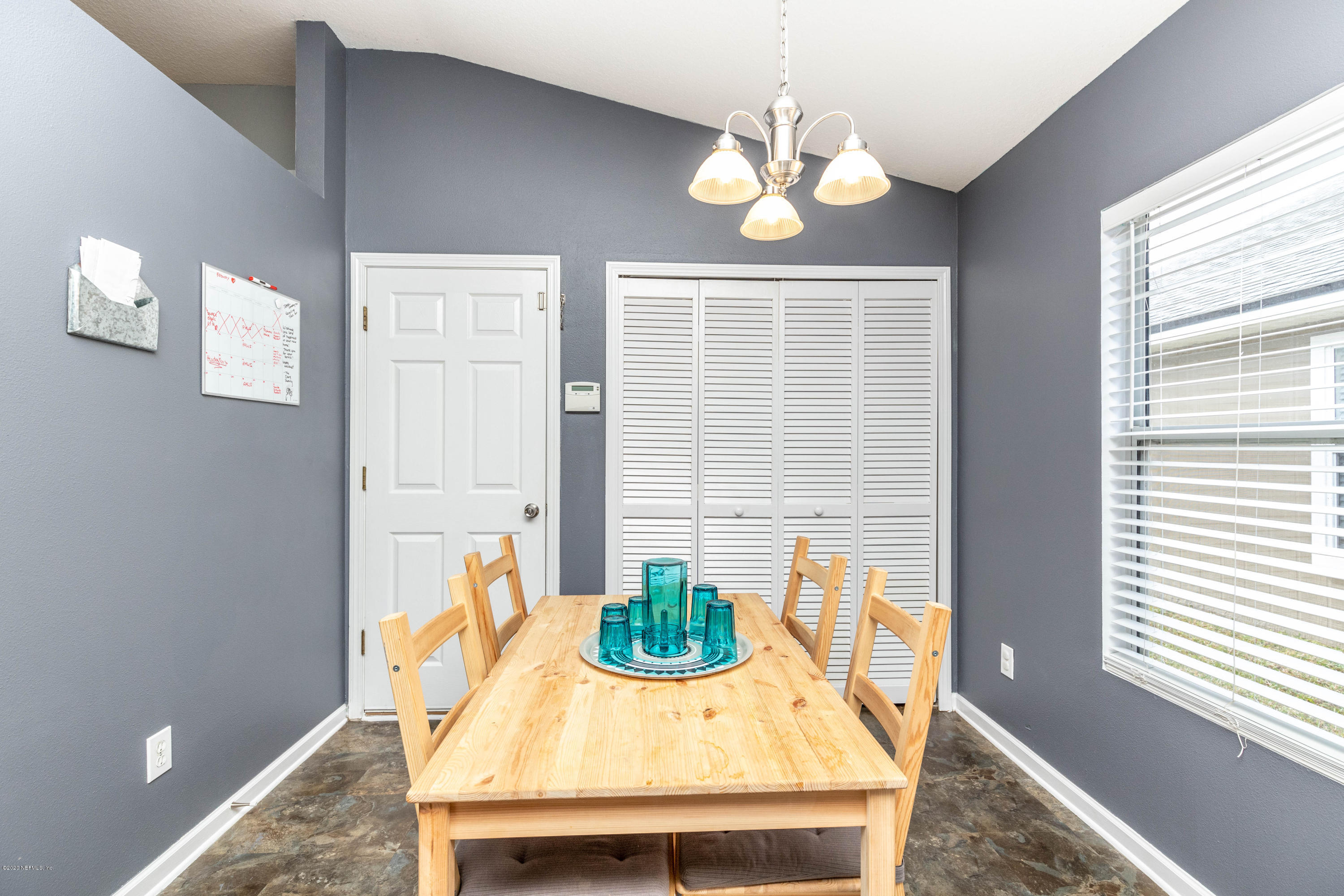 816 Crystal Spring Way St. Augustine, FL 32092 - Photo 8 of 44 a view of a dining room with furniture and chandelier
