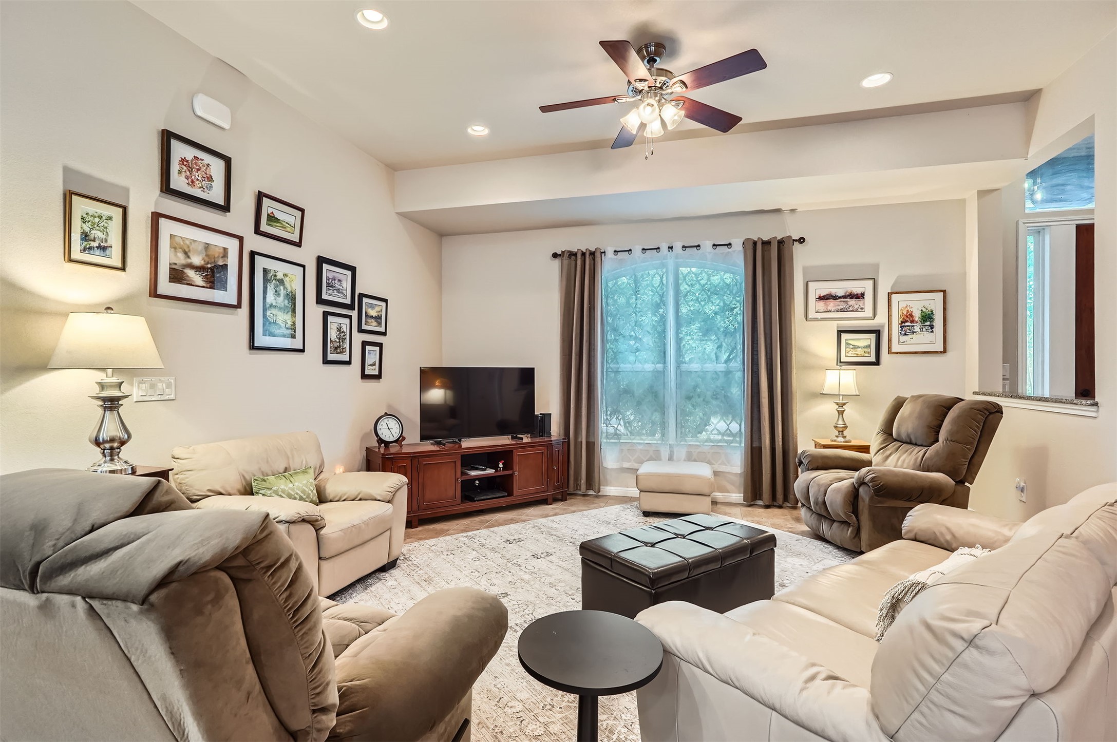 5501 Hitching Post Lago Vista, TX 78645 - Photo 5 of 26 a living room with furniture ceiling fan and a window