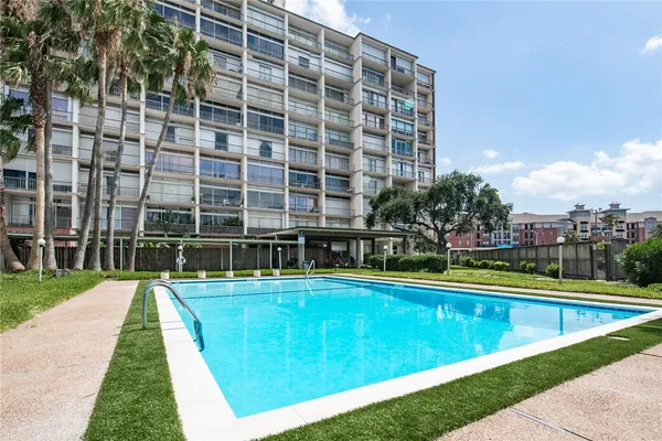 a view of swimming pool with outdoor space and seating area
