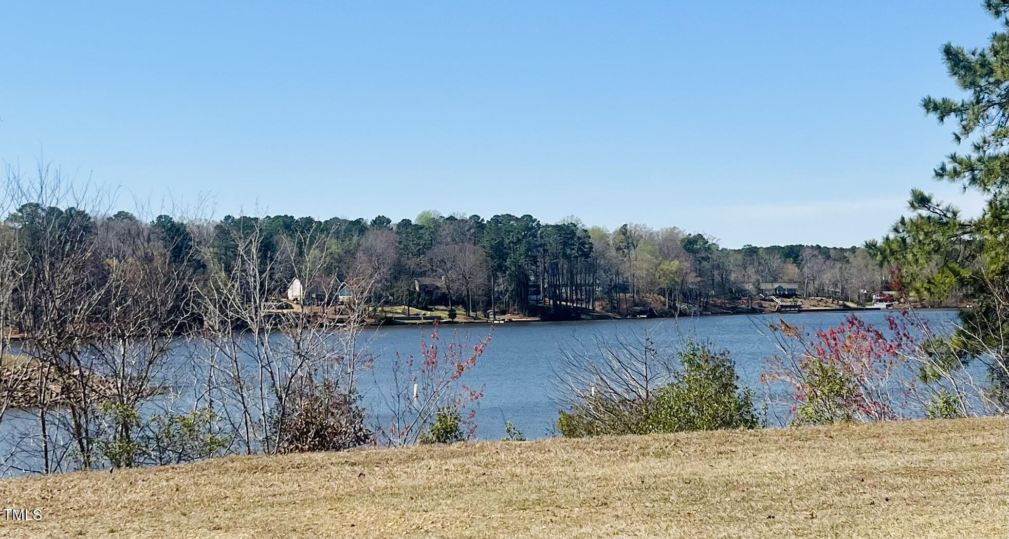 119-121 Osage Drive Spring Hope, NC 27882 - Photo 4 of 5 a view of a lake with houses