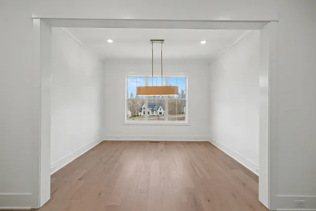 a bathroom with a double vanity sink a mirror a shower and a bathtub