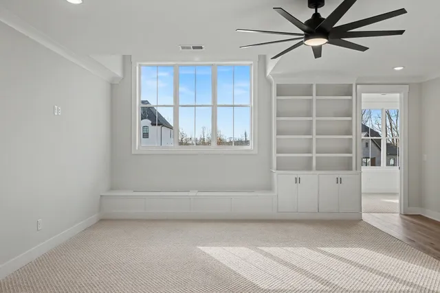 a view of a kitchen with a sink and a refrigerator
