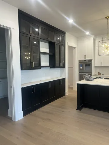 a bathroom with a sink vanity and a mirror