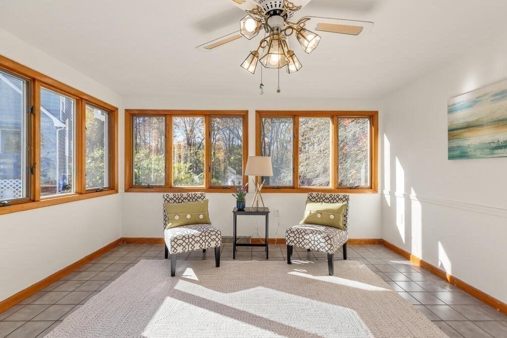 34 Locust Street Burlington, MA 01803 - Photo 11 of 24 a living room with furniture and a large window