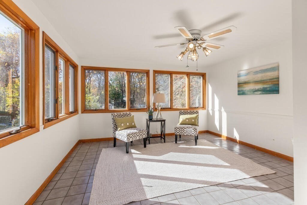 34 Locust Street Burlington, MA 01803 - Photo 12 of 24 a living room with furniture and a large window
