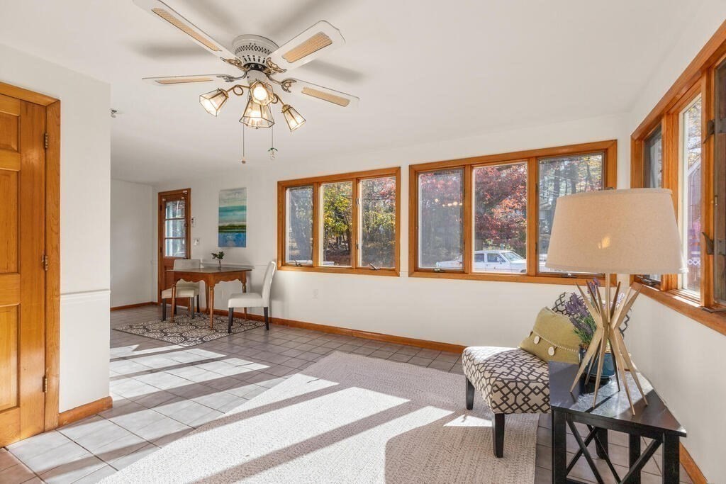 34 Locust Street Burlington, MA 01803 - Photo 13 of 24 a dining room with furniture a chandelier and wooden floor