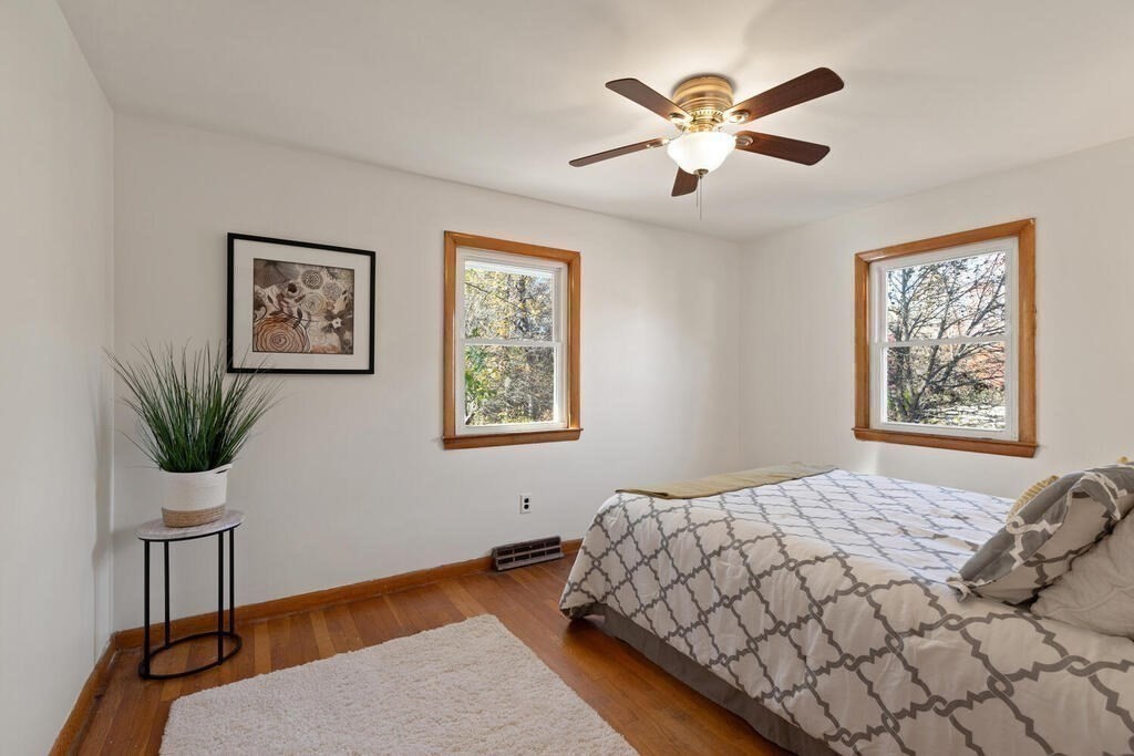 34 Locust Street Burlington, MA 01803 - Photo 14 of 24 a bedroom with a bed and a painting on the wall