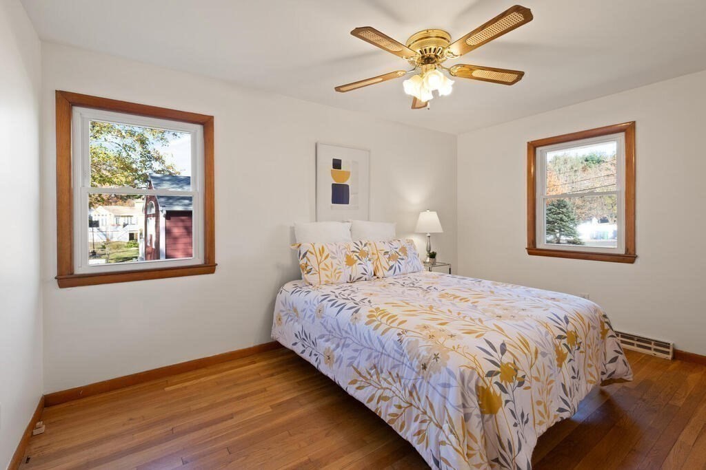 34 Locust Street Burlington, MA 01803 - Photo 15 of 24 a bedroom with a bed and a window