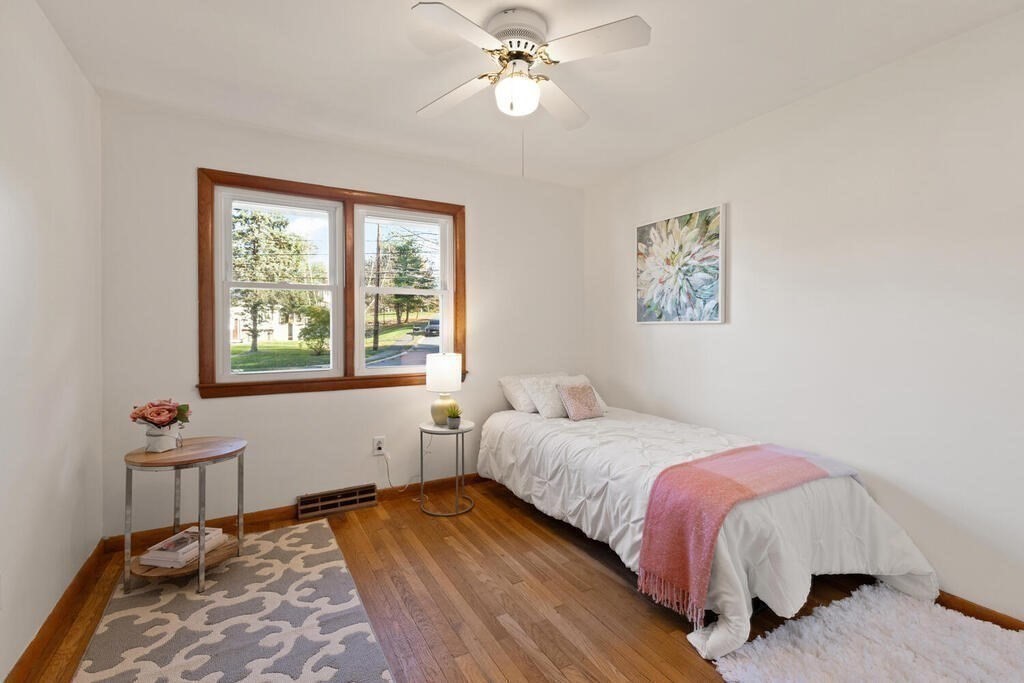 34 Locust Street Burlington, MA 01803 - Photo 16 of 24 a bedroom with a bed and a window