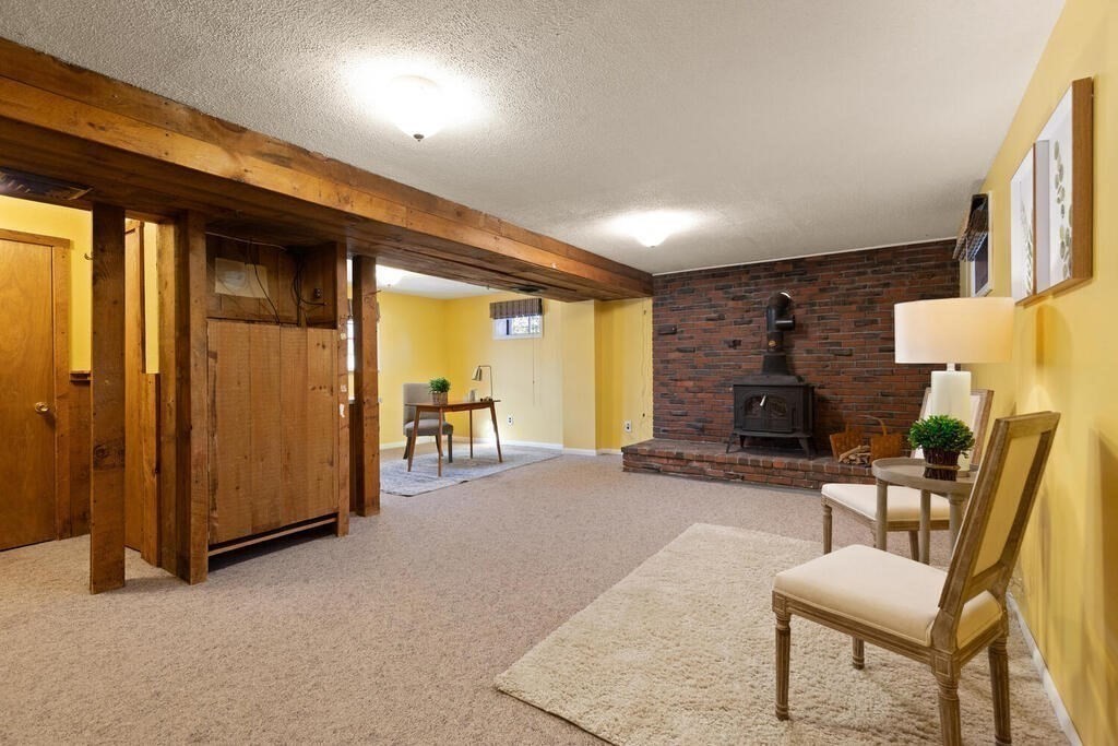 34 Locust Street Burlington, MA 01803 - Photo 17 of 24 an outdoor view of a livingroom with furniture and a fireplace