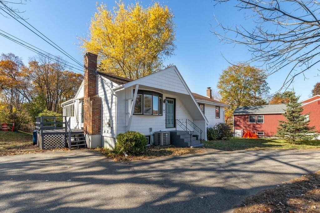 34 Locust Street Burlington, MA 01803 - Photo 2 of 24 a front view of a house with a yard