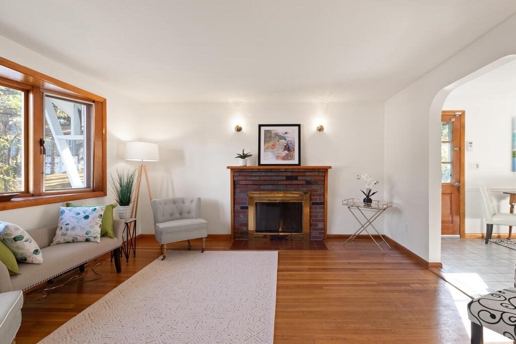 34 Locust Street Burlington, MA 01803 - Photo 4 of 24 a living room with furniture and a fireplace