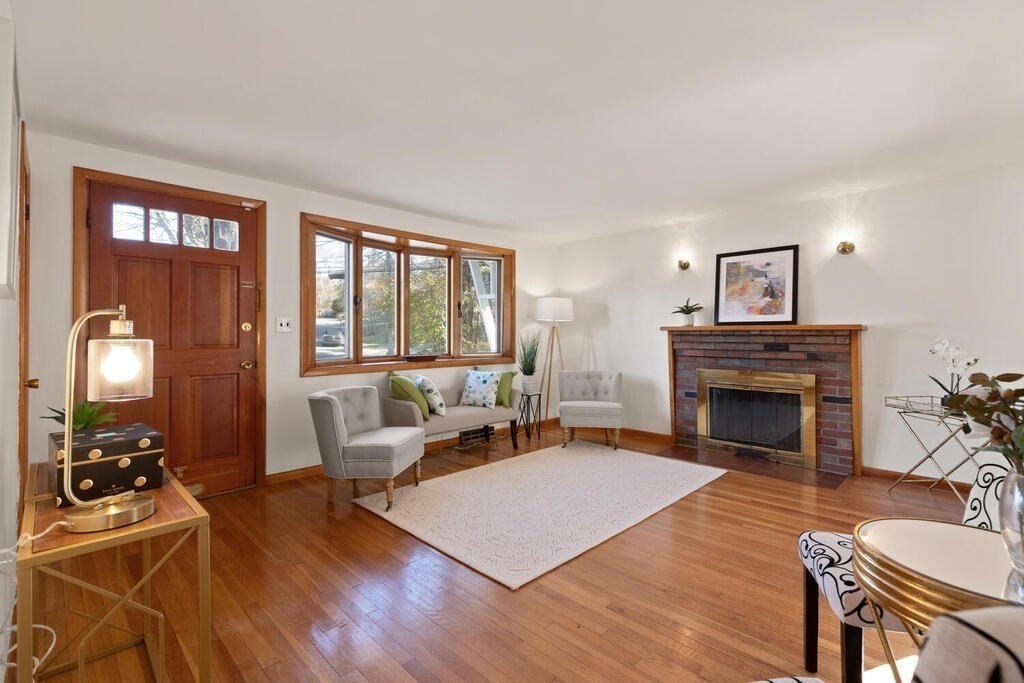 34 Locust Street Burlington, MA 01803 - Photo 5 of 24 a living room with furniture and a fireplace