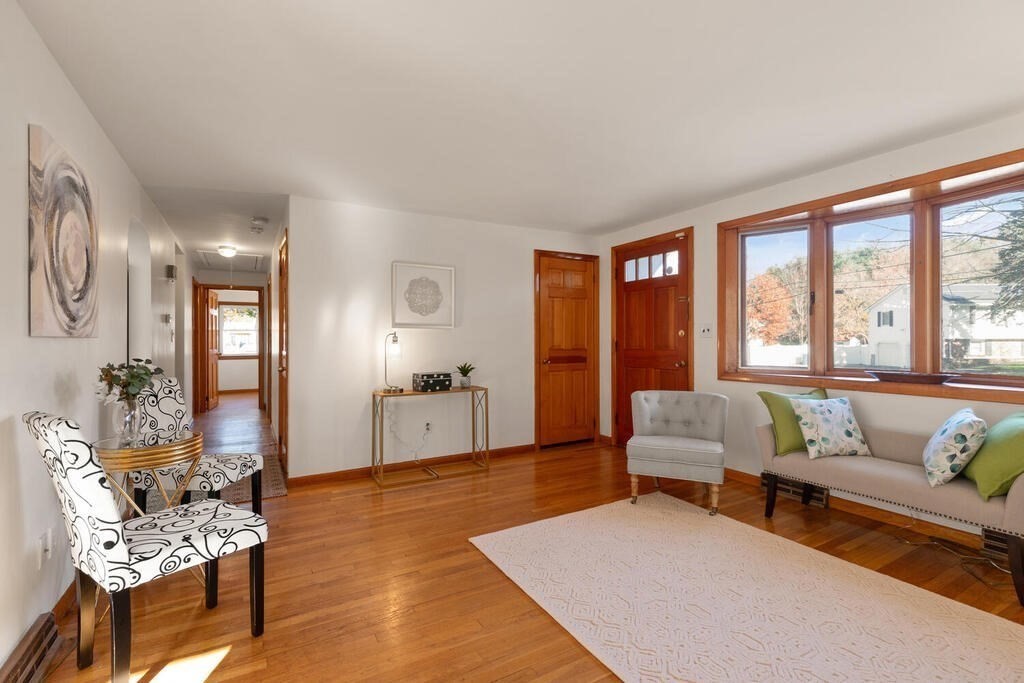 34 Locust Street Burlington, MA 01803 - Photo 6 of 24 a living room with furniture and large windows