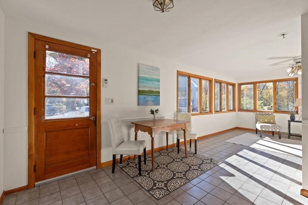 34 Locust Street Burlington, MA 01803 - Photo 7 of 24 a living room with furniture a window and a table