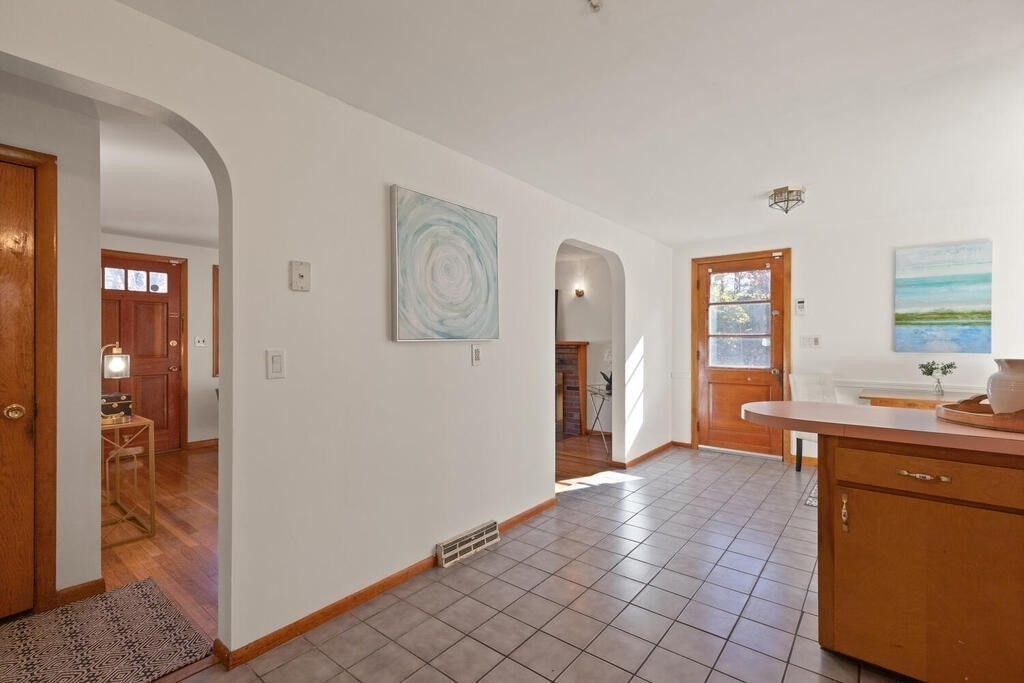34 Locust Street Burlington, MA 01803 - Photo 9 of 24 a view of a hallway with bathroom and mirror