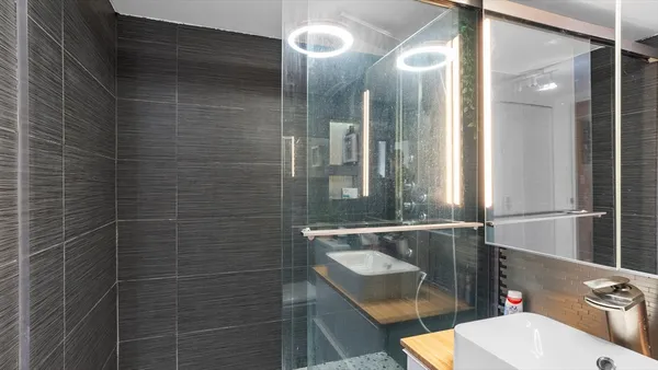a bathroom with a sink and mirror