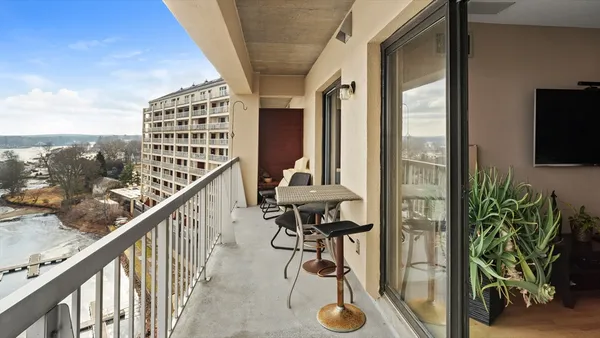 a view of balcony with furniture