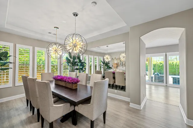 a bathroom with a sink mirror vanity and toilet