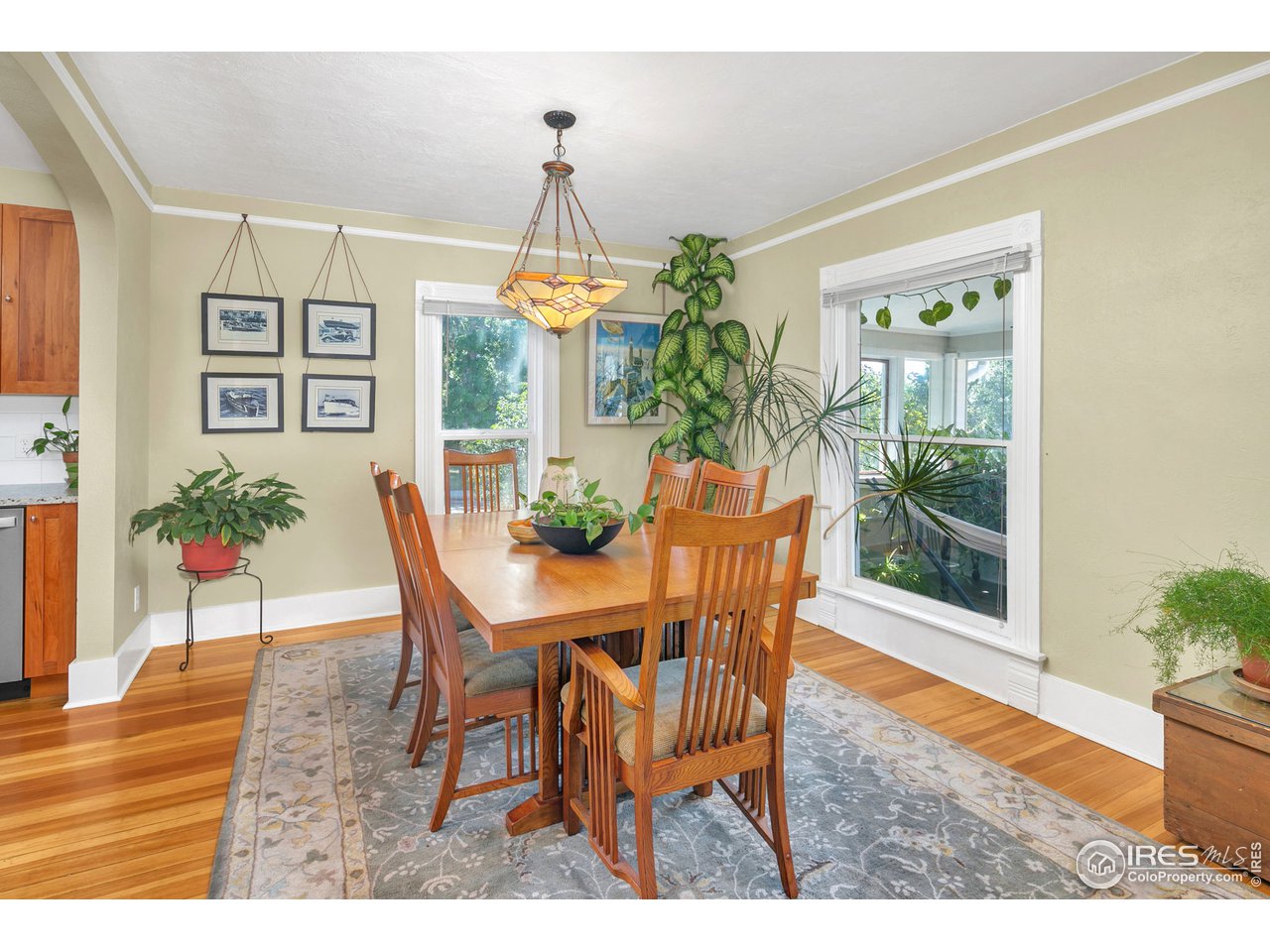 1500 West Prospect Road Fort Collins, CO 80526 - Photo 11 of 34 a view of a dining room with furniture and chandelier