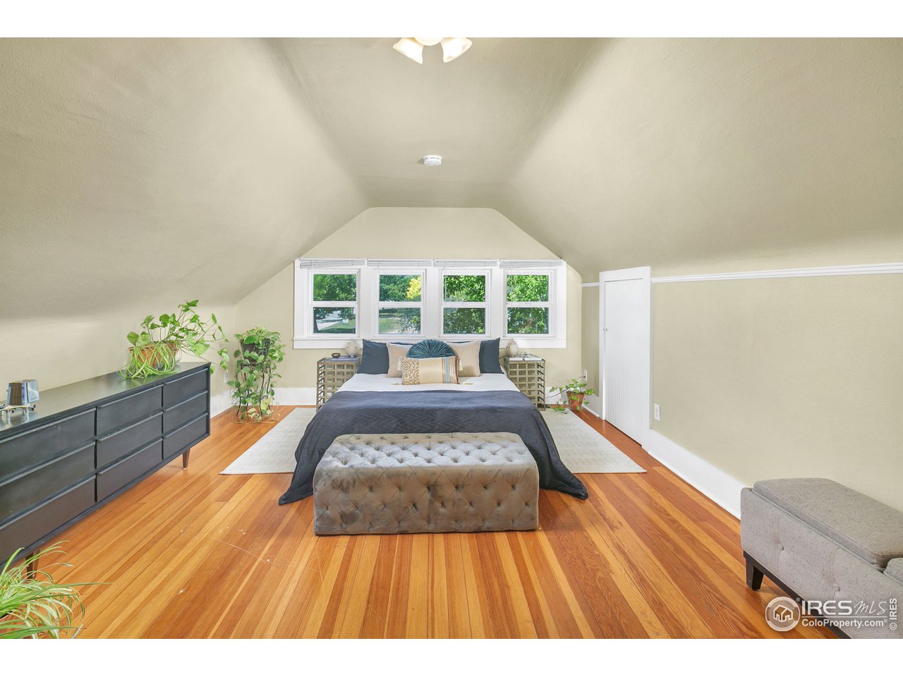 1500 West Prospect Road Fort Collins, CO 80526 - Photo 20 of 34 a spacious bedroom with a bed and a window
