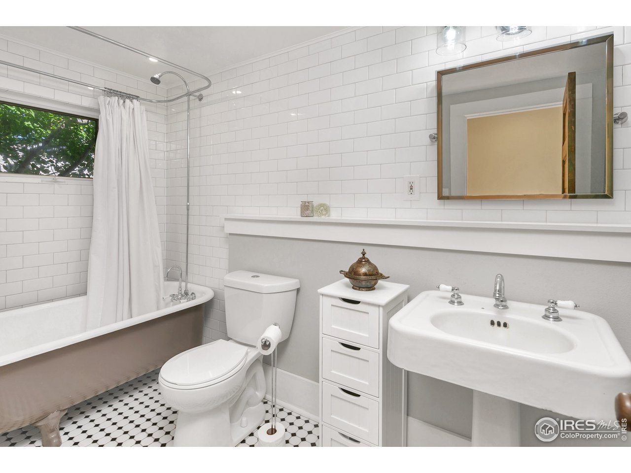 1500 West Prospect Road Fort Collins, CO 80526 - Photo 7 of 34 a bathroom with a sink toilet and mirror
